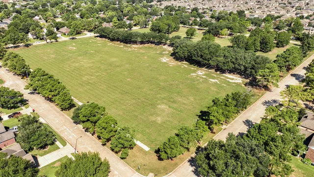 a view of a lake with a yard