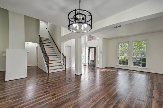 a view of an entryway with wooden floor