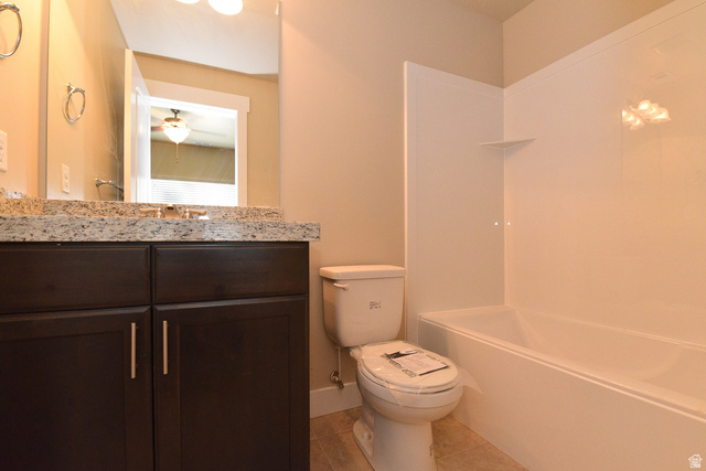 241 West Ridge Road Saratoga Springs, UT 84045 - Photo 13 of 21 Bathroom featuring a dark wood-finish vanity with granite countertop, undermount sink, and chrome faucet