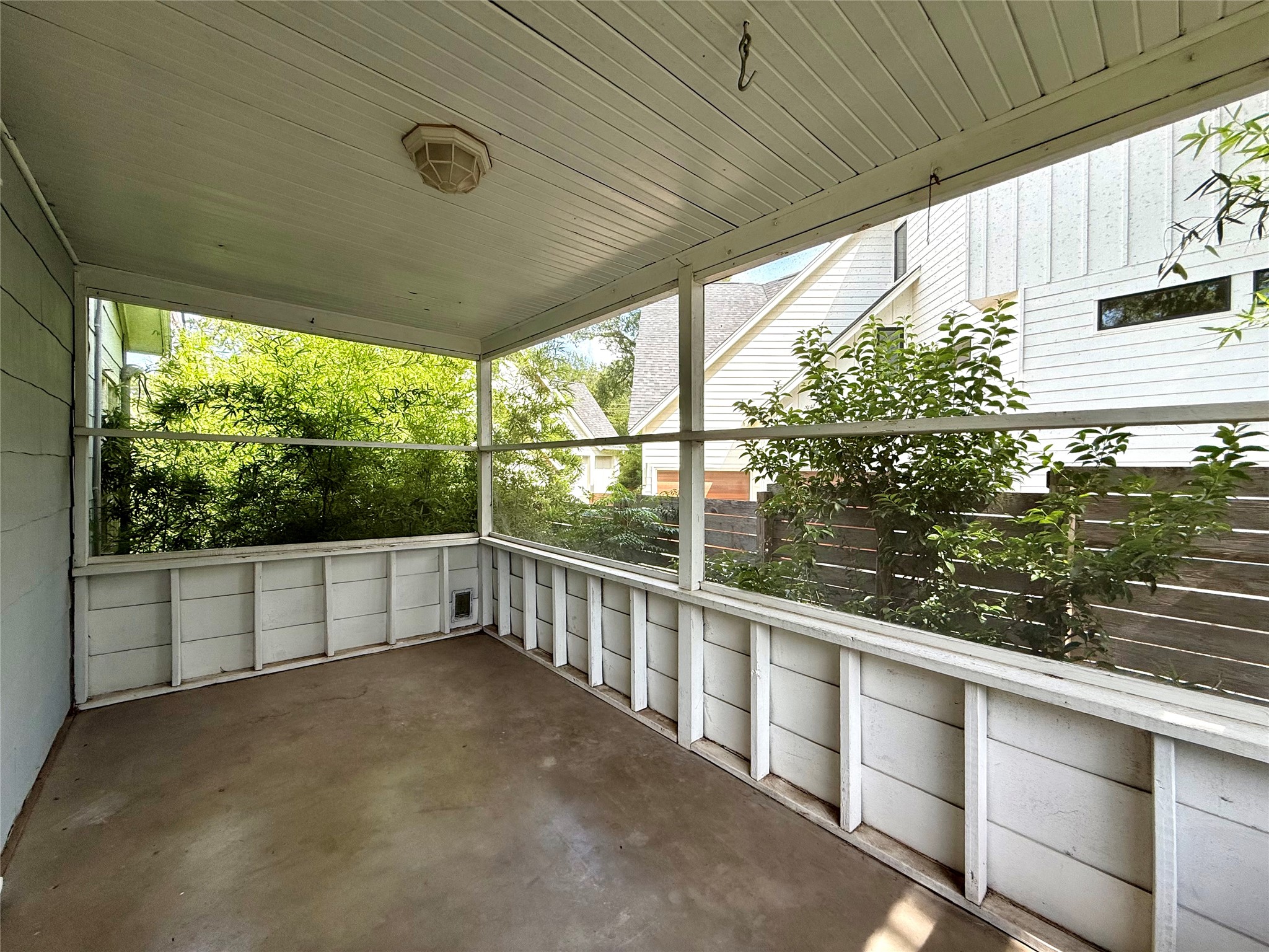 3305 Merrie Lynn Avenue Austin, TX 78722 - Photo 13 of 22 A private, screened porch offers a tranquil outdoor retreat.