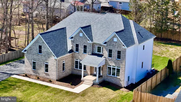 a aerial view of a house with a yard deck and slide