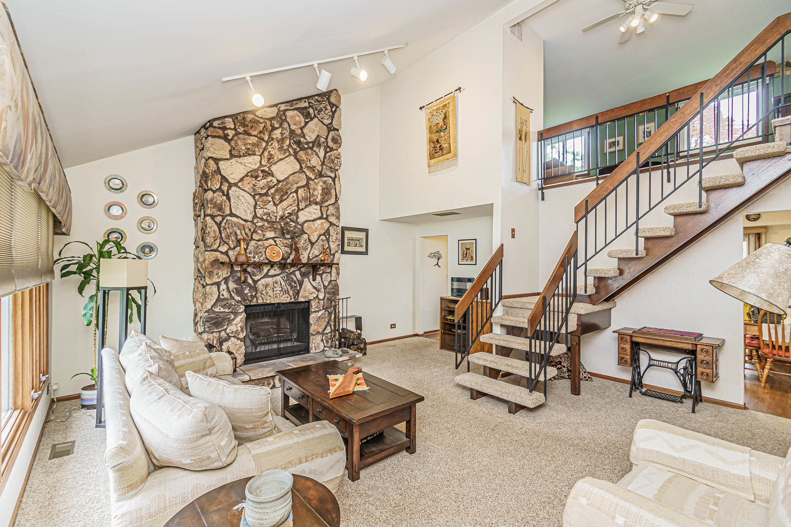 950 Ridgefield Lane Buffalo Grove, IL 60089 - Photo 3 of 24 a living room with furniture and a fireplace