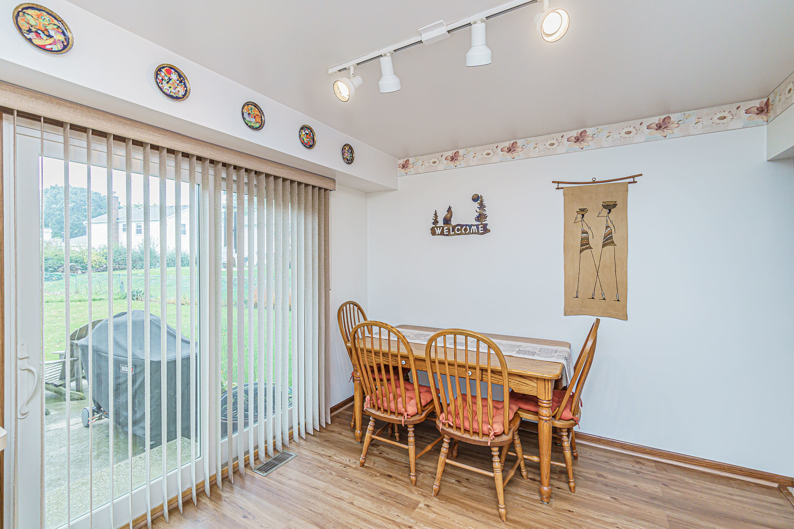 950 Ridgefield Lane Buffalo Grove, IL 60089 - Photo 6 of 24 a view of a dining room with furniture window and wooden floor