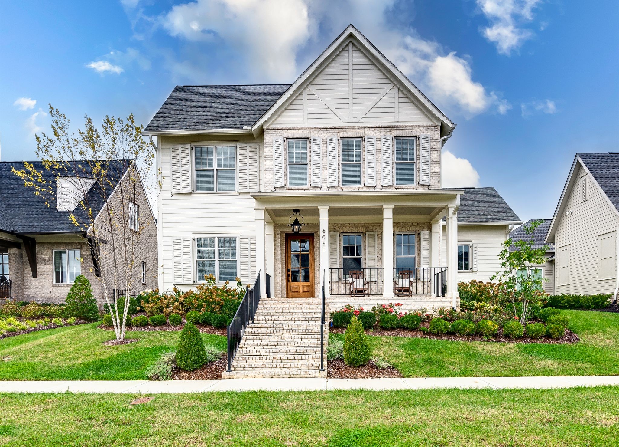6081 Pasquo Road Nashville, TN 37221 - Photo 1 of 70 a front view of a house with a yard
