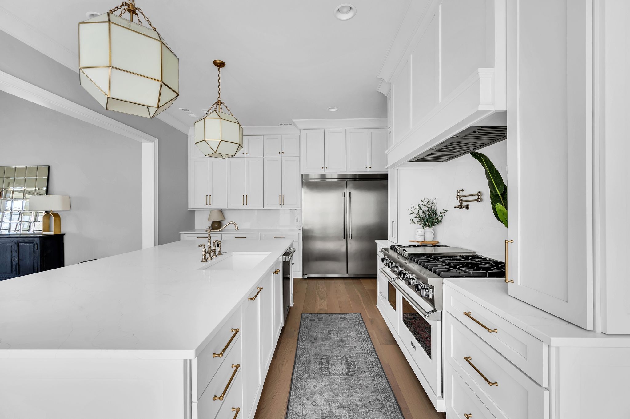 6081 Pasquo Road Nashville, TN 37221 - Photo 19 of 70 a kitchen with stainless steel appliances granite countertop a sink a stove and a refrigerator