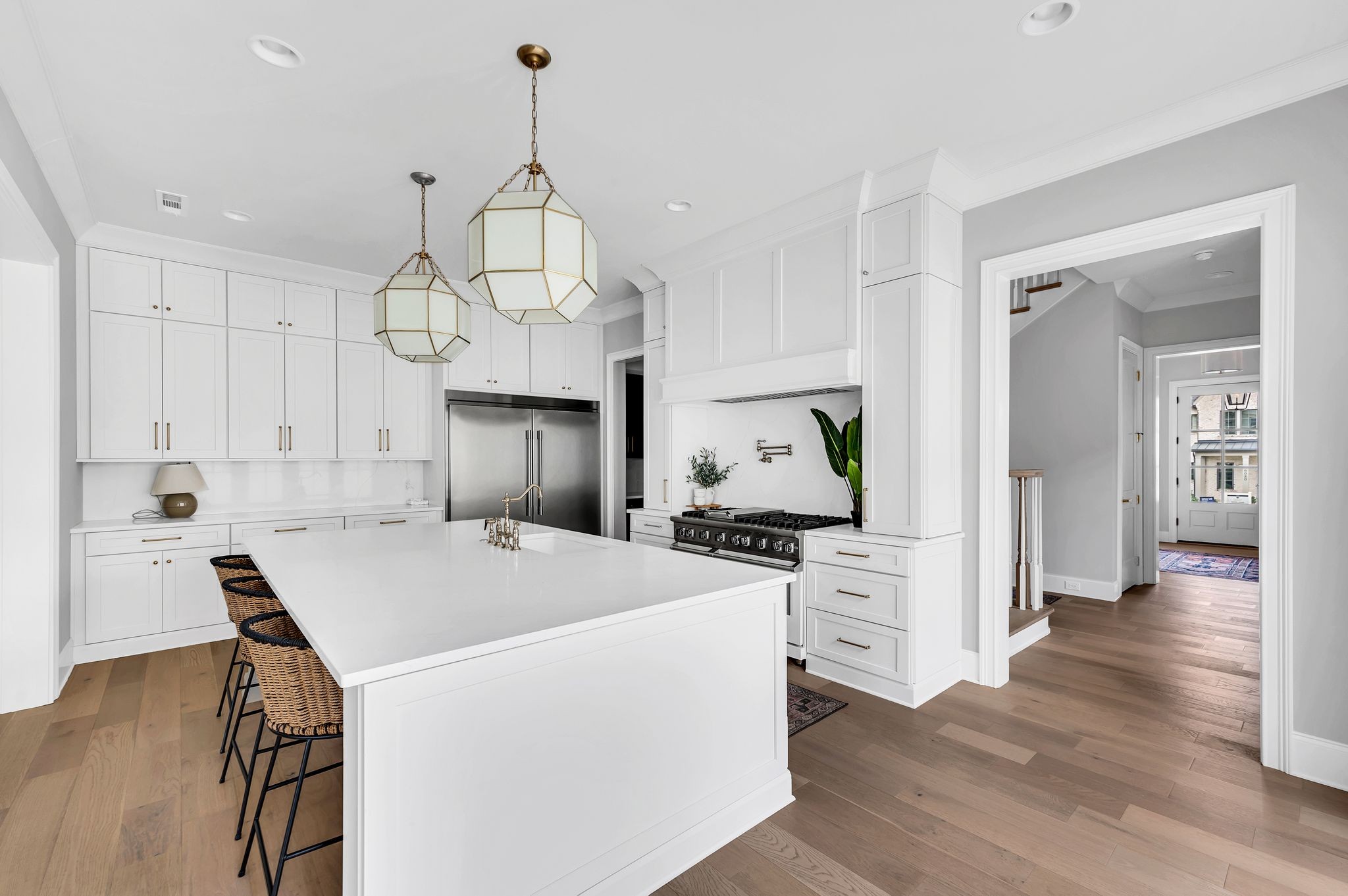 6081 Pasquo Road Nashville, TN 37221 - Photo 20 of 70 a kitchen that has a lot of white cabinets and stainless steel appliances