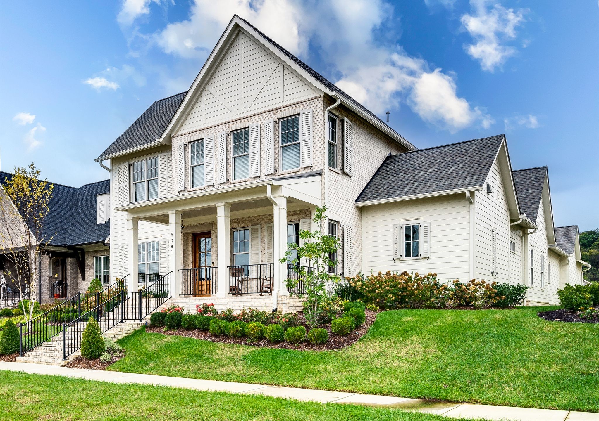 6081 Pasquo Road Nashville, TN 37221 - Photo 2 of 70 a front view of a house with a yard