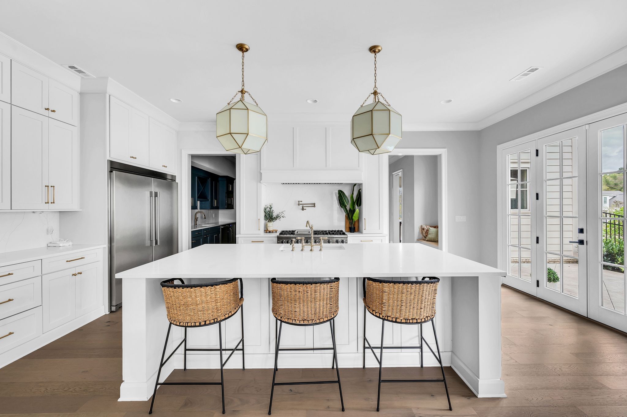 6081 Pasquo Road Nashville, TN 37221 - Photo 22 of 70 a view of a dining room with furniture wooden floor and a chandelier