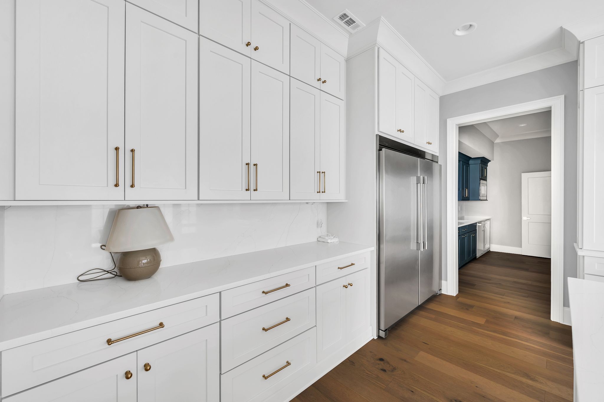 6081 Pasquo Road Nashville, TN 37221 - Photo 24 of 70 a kitchen with white cabinets and refrigerator