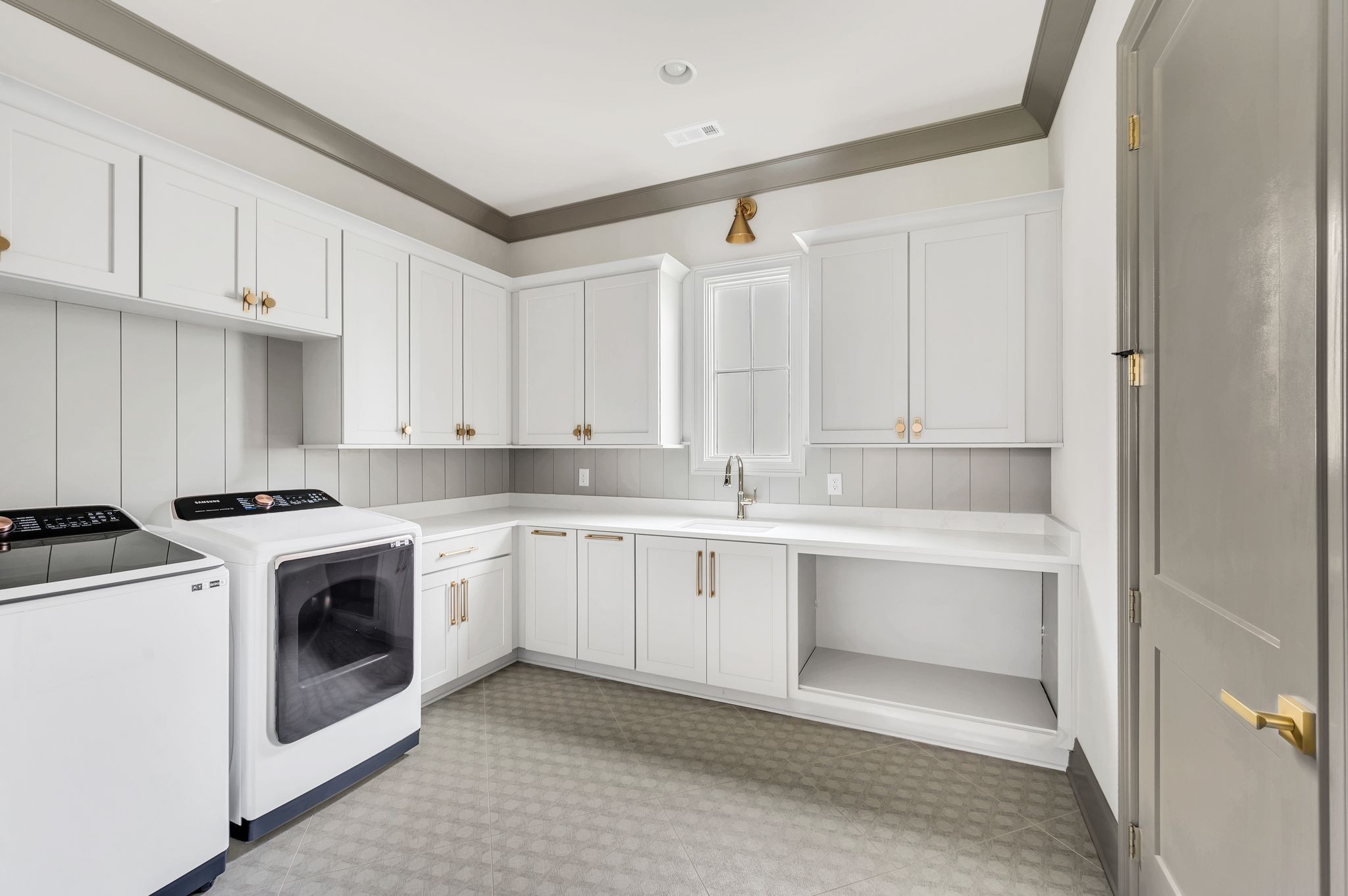 6081 Pasquo Road Nashville, TN 37221 - Photo 33 of 70 a kitchen with granite countertop white cabinets and white appliances