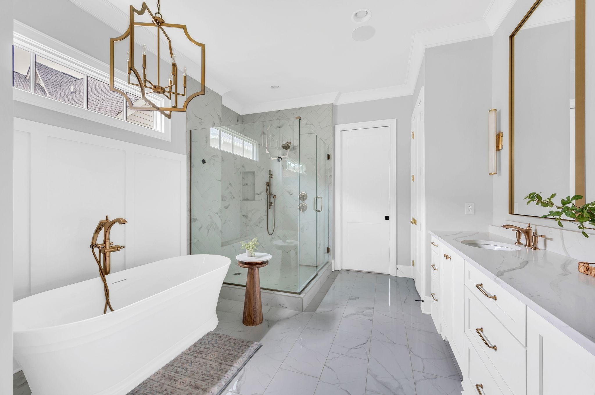 6081 Pasquo Road Nashville, TN 37221 - Photo 39 of 70 a spacious bathroom with a double vanity sink a toilet a mirror and bathtub
