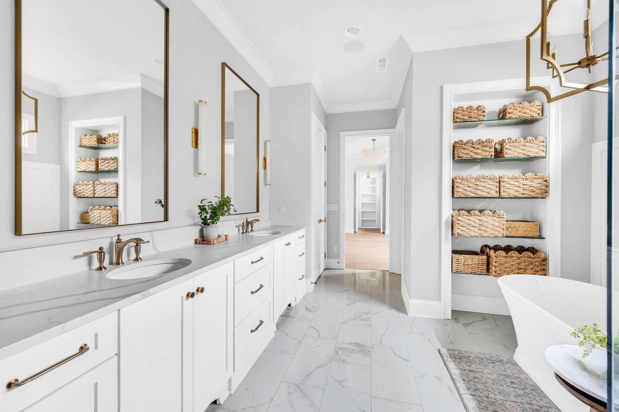 6081 Pasquo Road Nashville, TN 37221 - Photo 42 of 70 a bathroom with double vanity sinks a large mirror and a shower