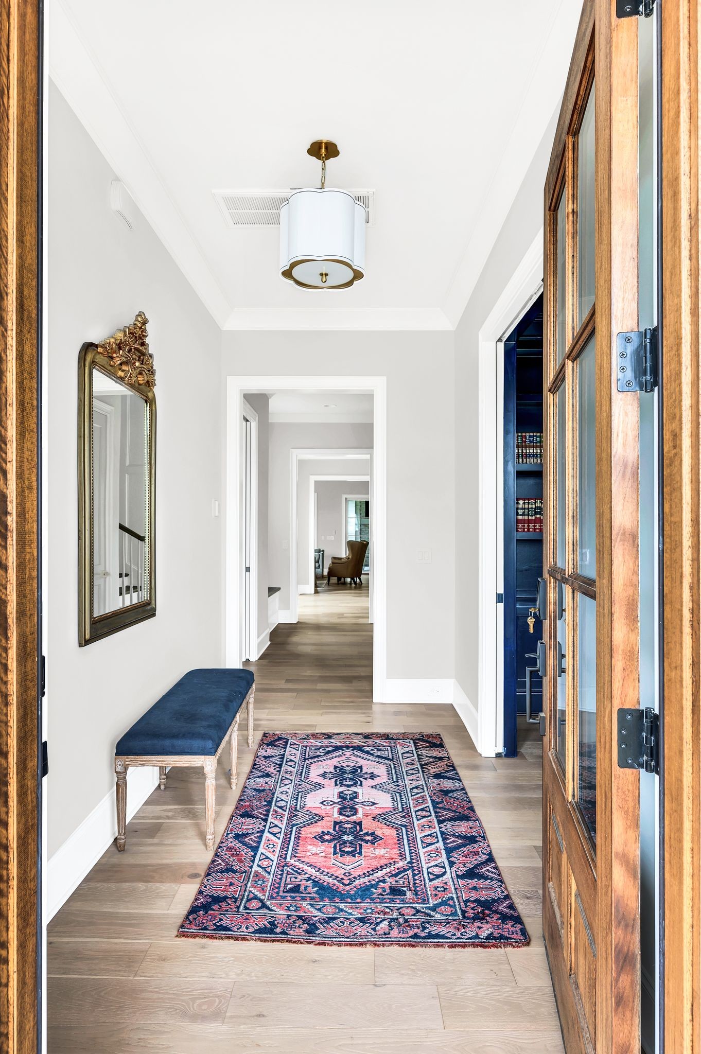 6081 Pasquo Road Nashville, TN 37221 - Photo 5 of 70 a view of a hallway with wooden floor and front door