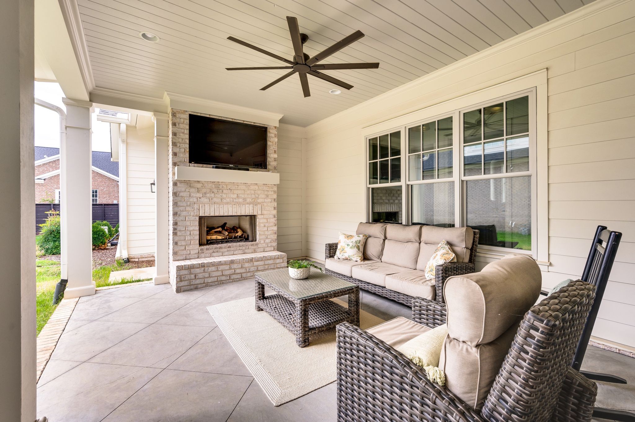 6081 Pasquo Road Nashville, TN 37221 - Photo 66 of 70 a living room with furniture fireplace and a flat screen tv