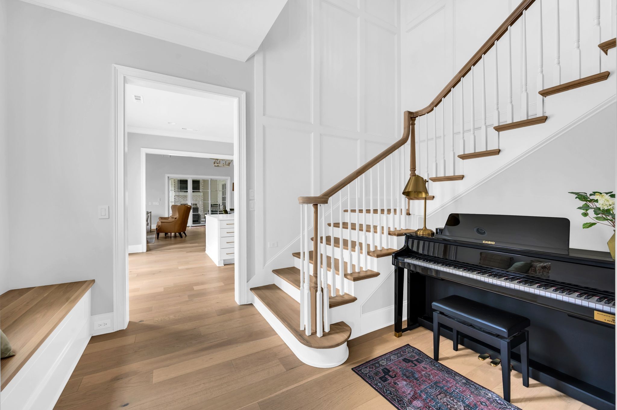 6081 Pasquo Road Nashville, TN 37221 - Photo 8 of 70 a living room with wooden floor and a piano