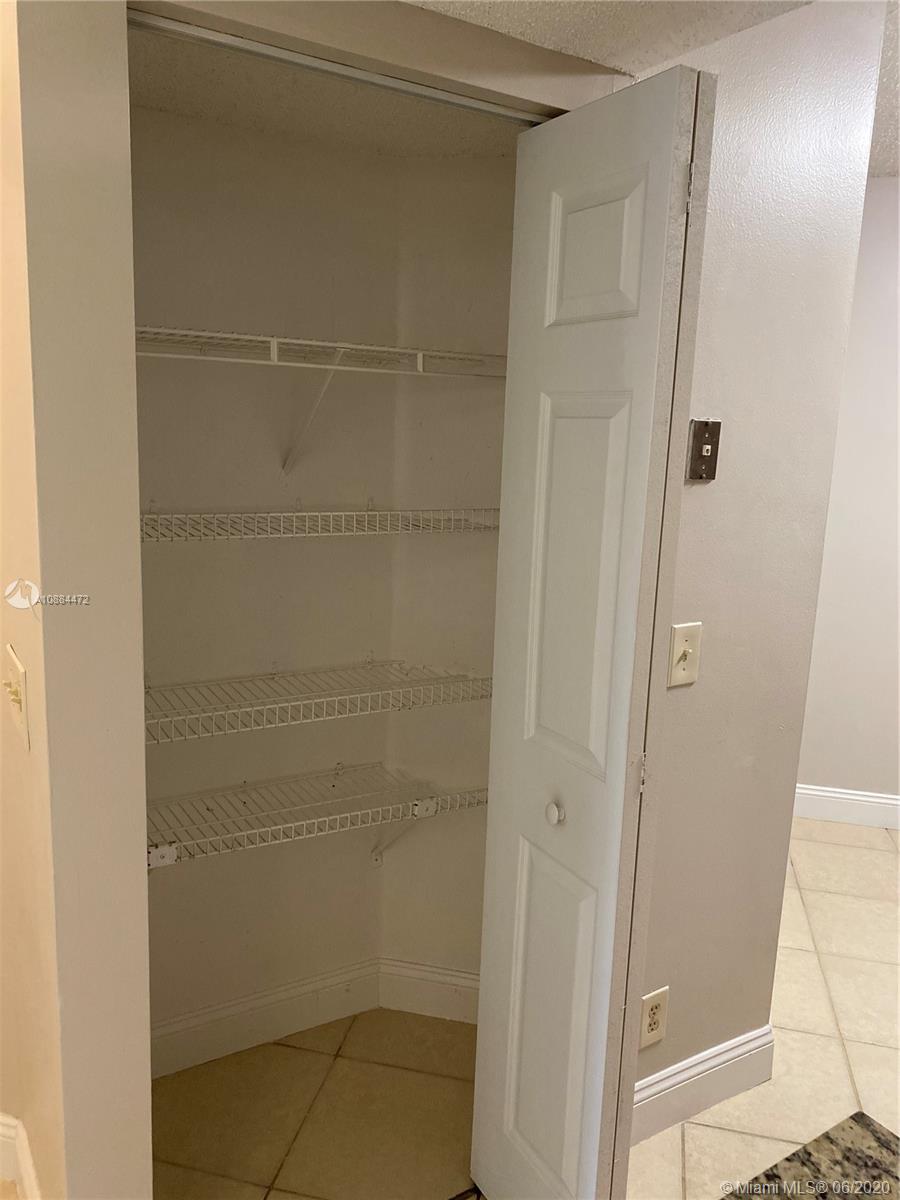 8741 Wiles Road, Unit 204 Coral Springs, FL 33067 - Photo 12 of 22 a bathroom with a glass door shower