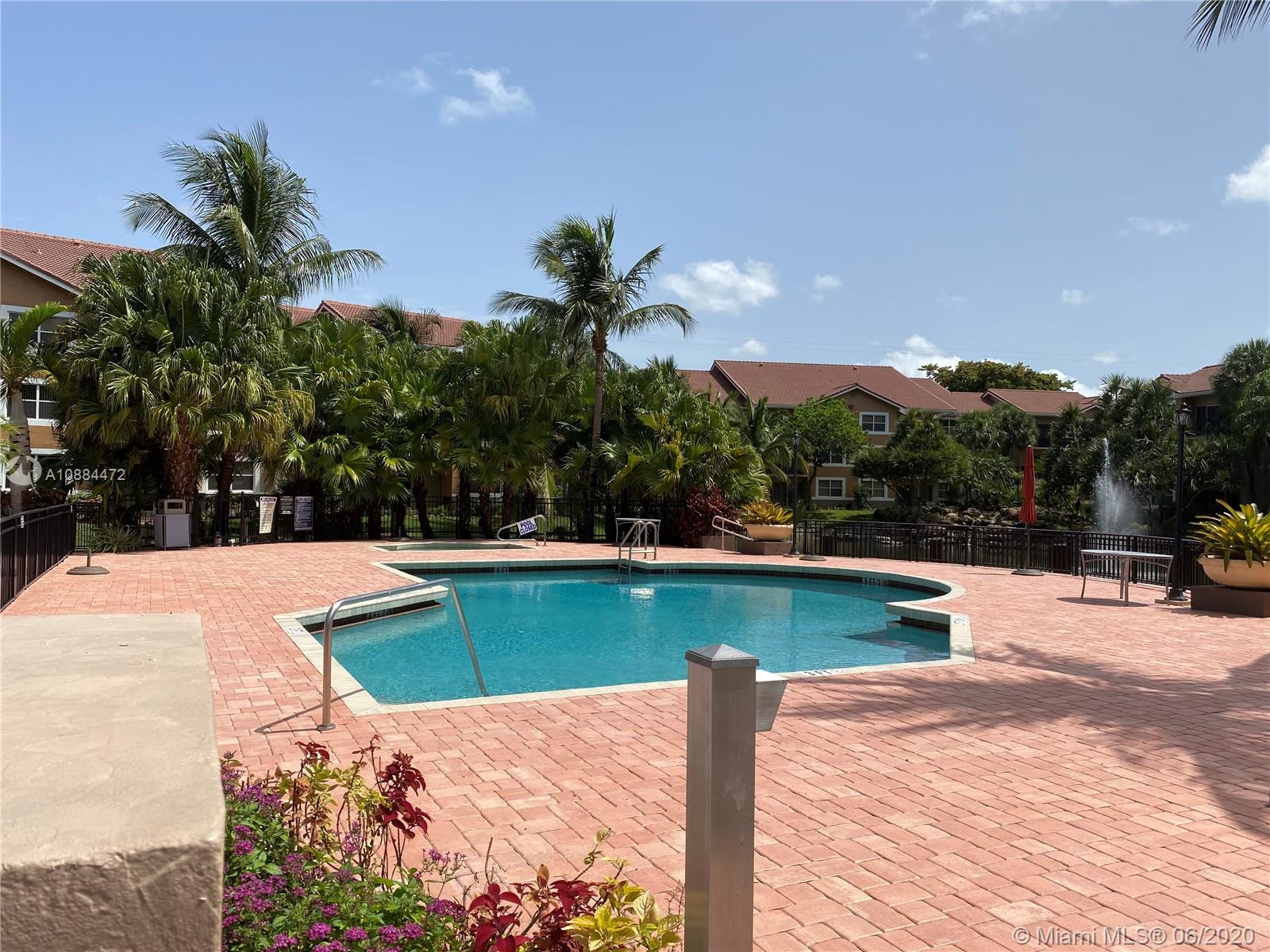8741 Wiles Road, Unit 204 Coral Springs, FL 33067 - Photo 16 of 22 a view of swimming pool with seating space