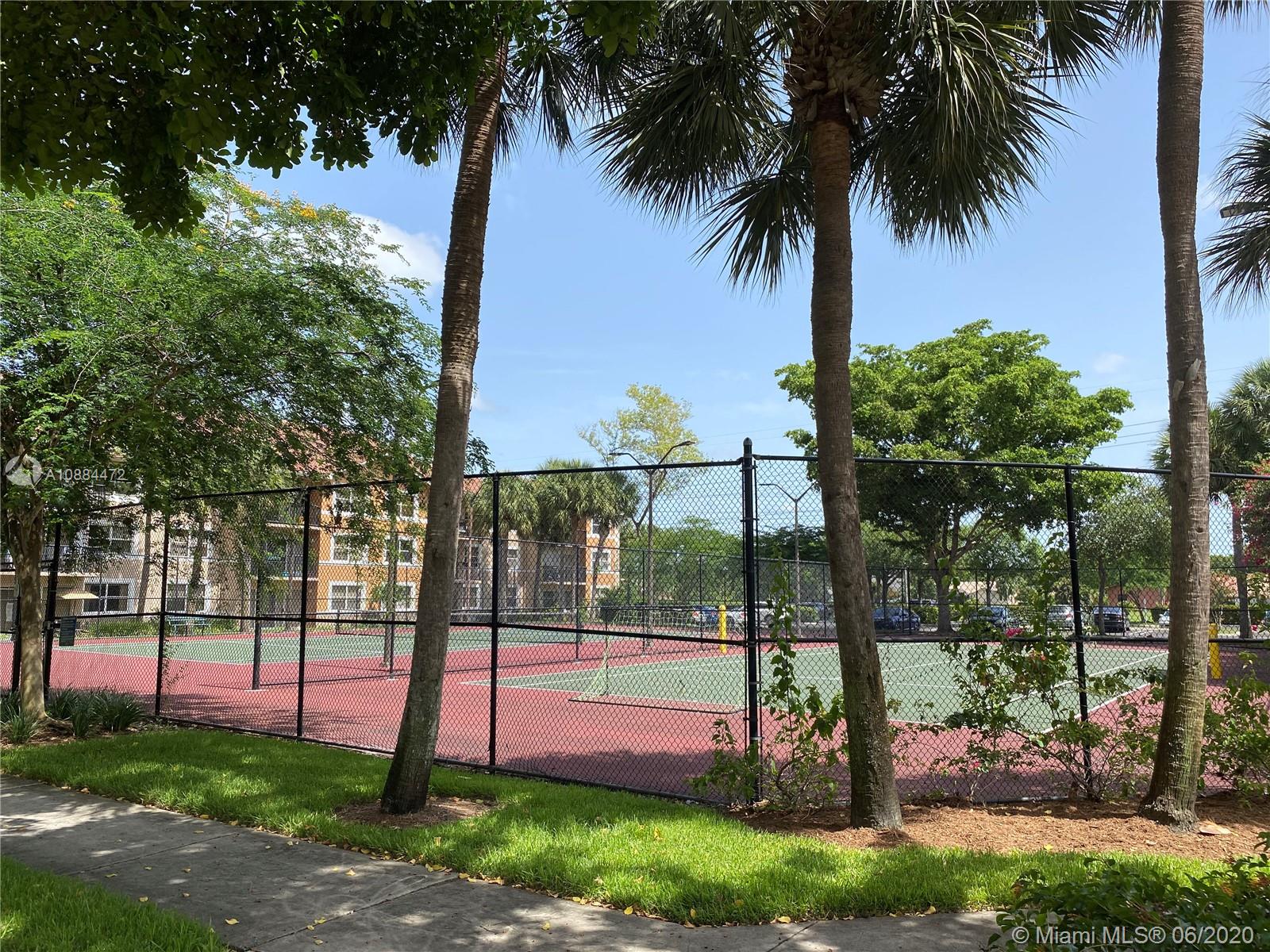 8741 Wiles Road, Unit 204 Coral Springs, FL 33067 - Photo 19 of 22 a view of a park with palm tree