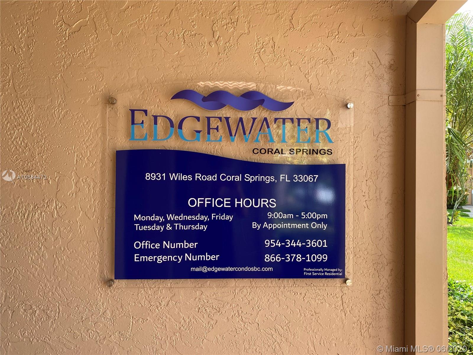 8741 Wiles Road, Unit 204 Coral Springs, FL 33067 - Photo 22 of 22 a sign on the wall of a building