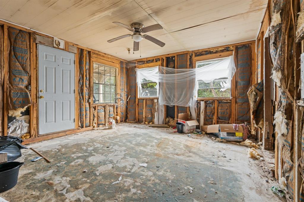116 Fox Run Whitney, TX 76692 - Photo 27 of 34 a view of an empty room with a fireplace and a window