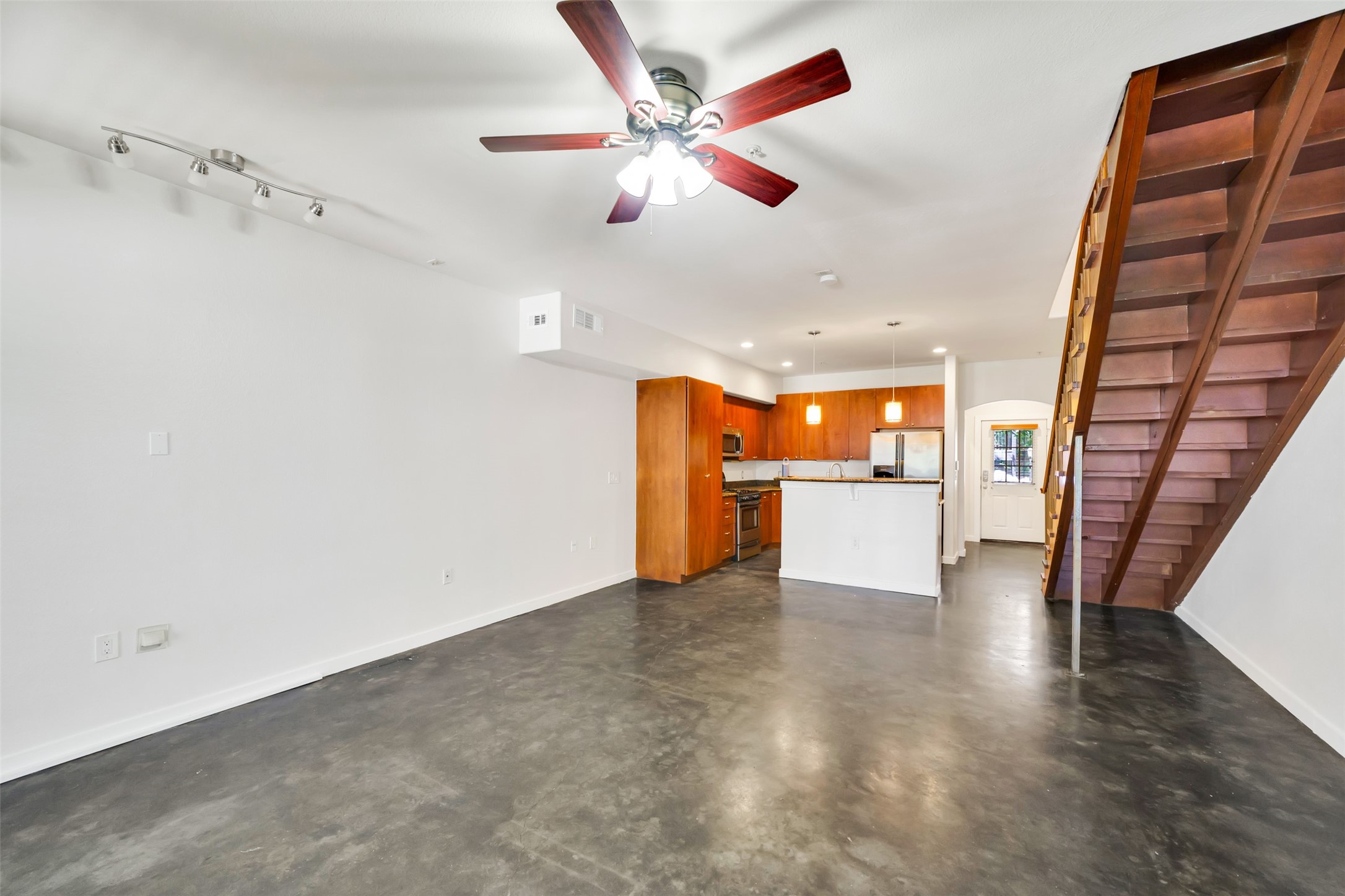 2216 Chenevert Street, Unit 6 Houston, TX 77003 - Photo 17 of 29 an empty room with wooden floor and windows
