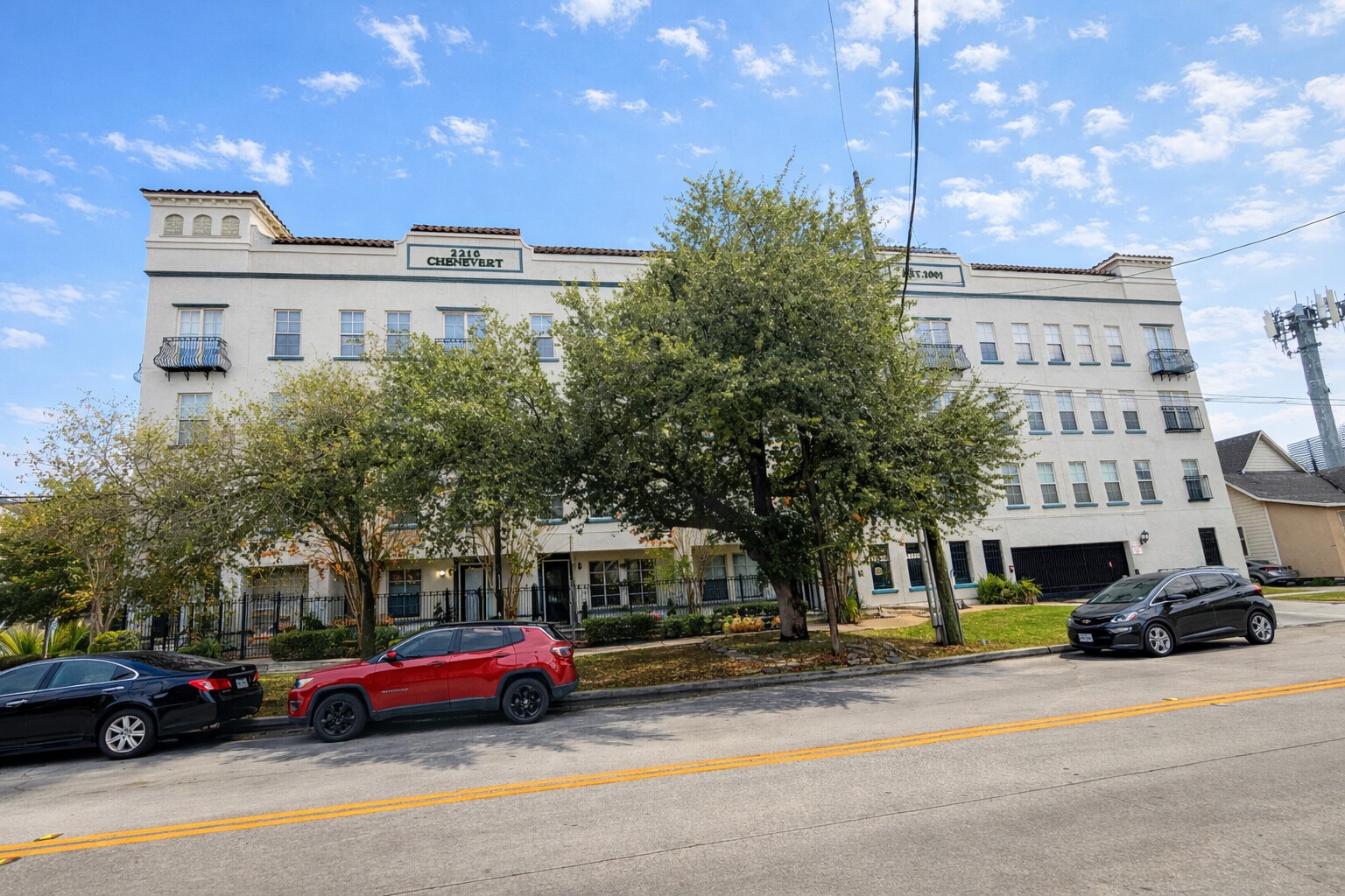 2216 Chenevert Street, Unit 6 Houston, TX 77003 - Photo 28 of 29 a front view of a building with cars parked