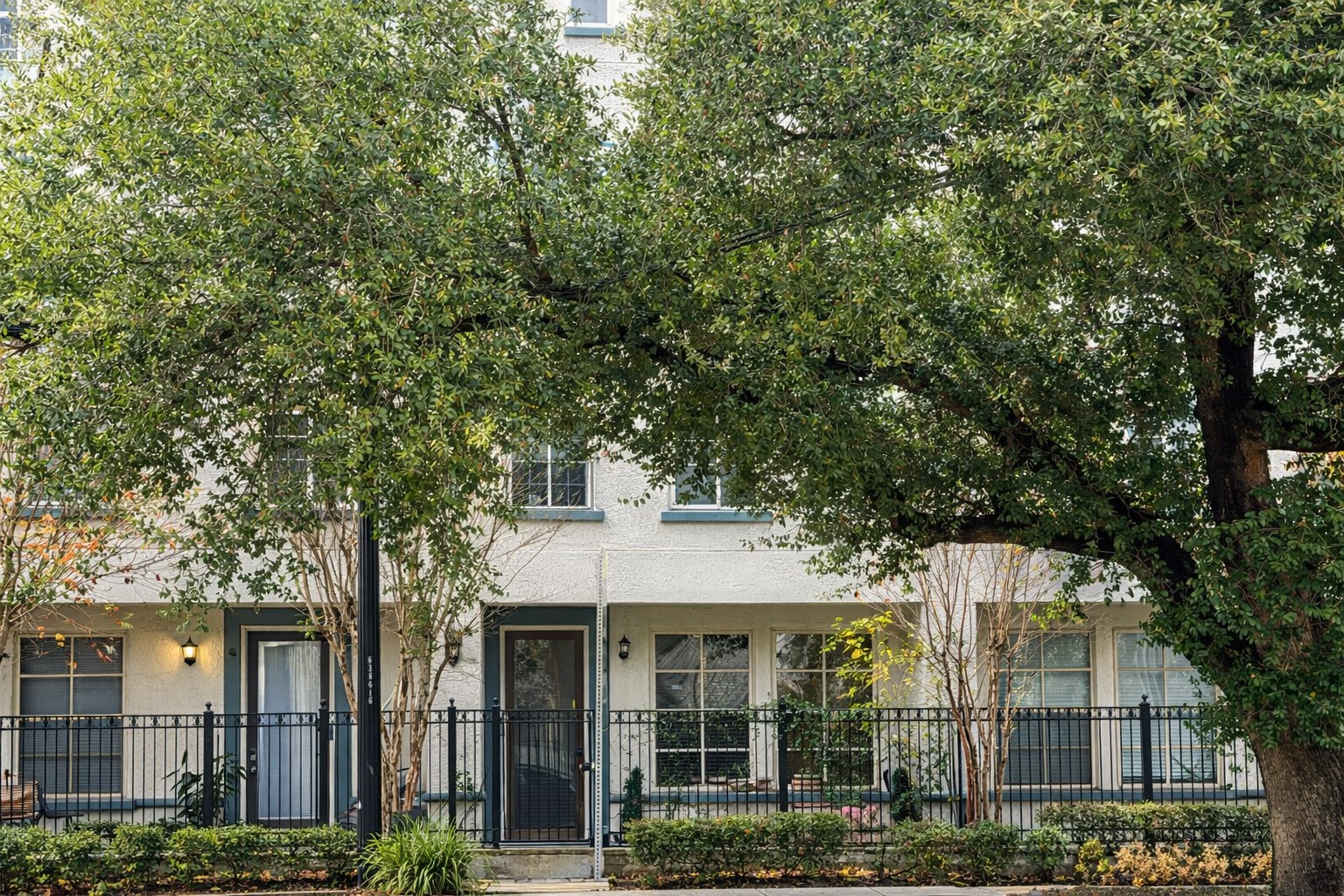 2216 Chenevert Street, Unit 6 Houston, TX 77003 - Photo 3 of 29 a front view of a house with a garden