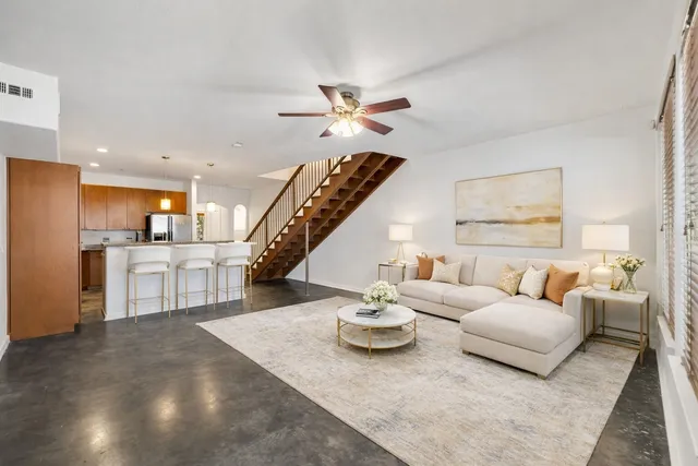 a kitchen with granite countertop a refrigerator stove and microwave