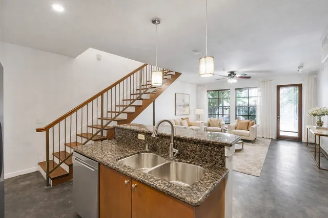 a kitchen with stove and cabinets