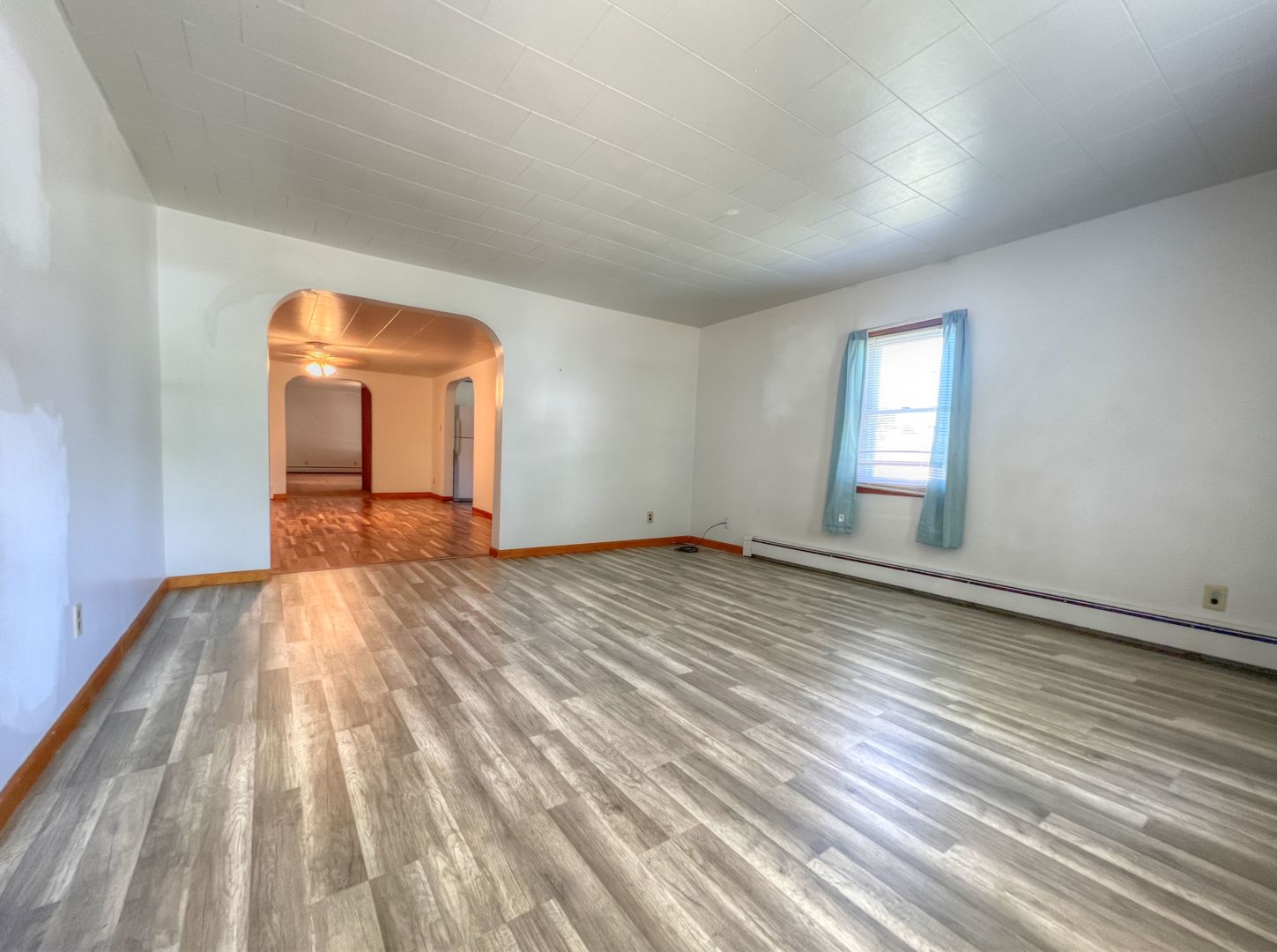 309 Jefferson Street Danforth, IL 60930 - Photo 11 of 45 wooden floor in an empty room with a window