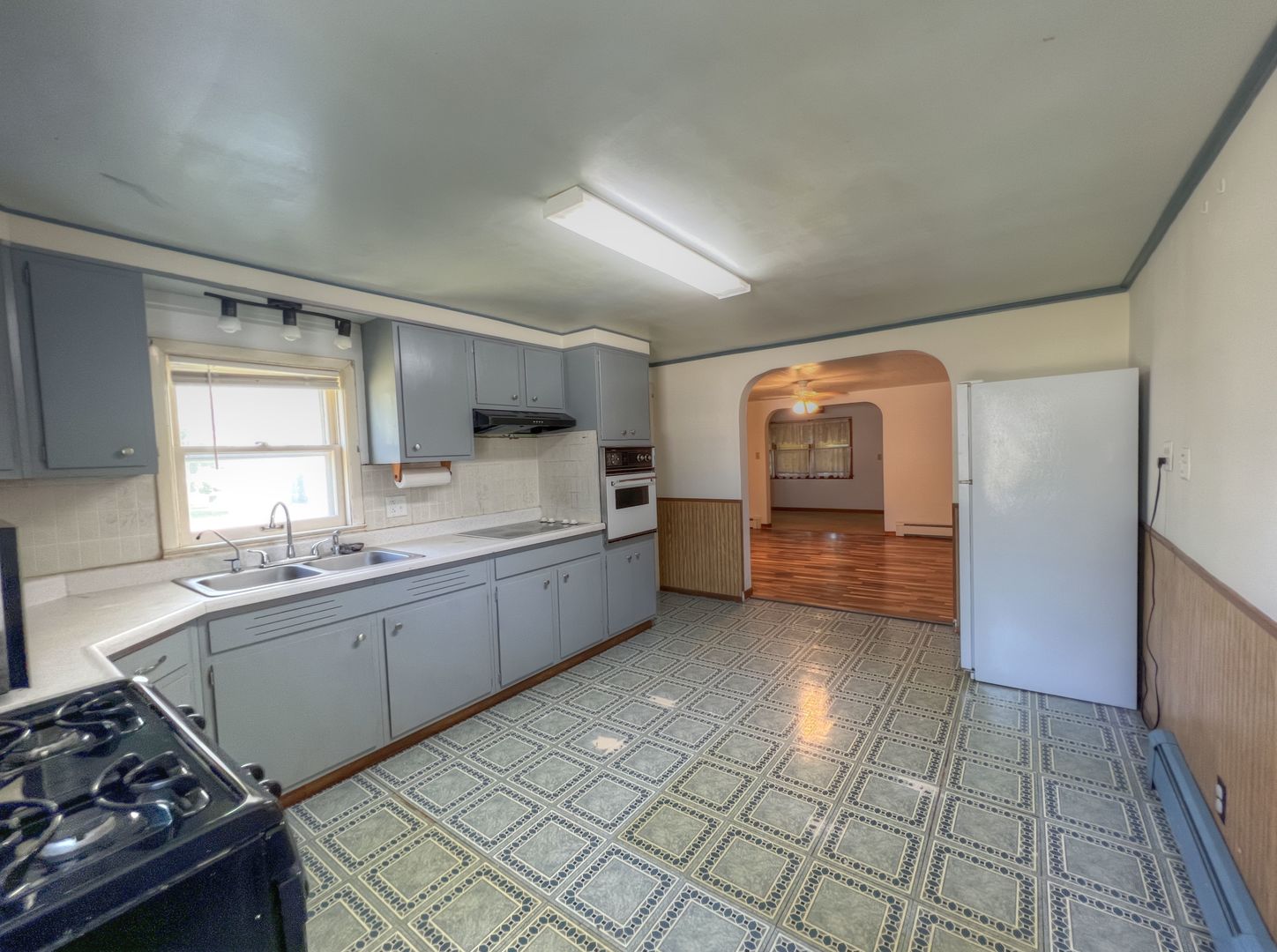 309 Jefferson Street Danforth, IL 60930 - Photo 22 of 45 a kitchen with stainless steel appliances a sink stove and cabinets