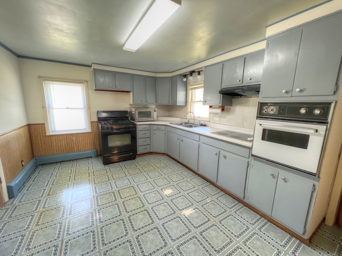 309 Jefferson Street Danforth, IL 60930 - Photo 23 of 45 a kitchen with stainless steel appliances granite countertop a sink and cabinets