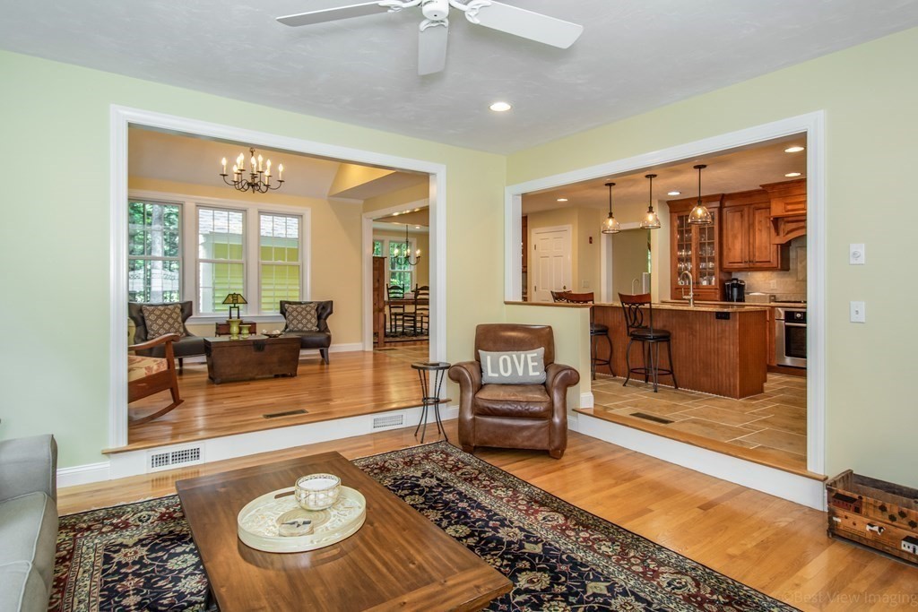 61 Coolidge Farm Road Boxborough, MA 01719 - Photo 11 of 39 a living room with furniture and a table