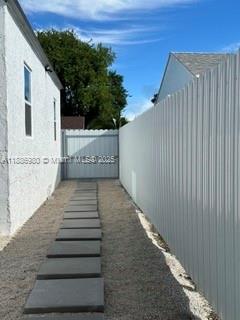 1084 Northwest 64th Street Miami, FL 33150 - Photo 2 of 12 a view of a pathway of a house