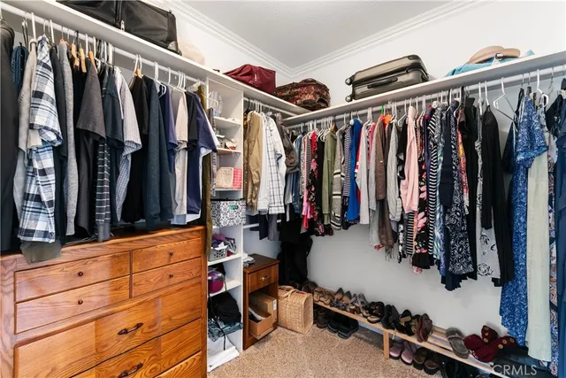 a room with pool table and wooden floor