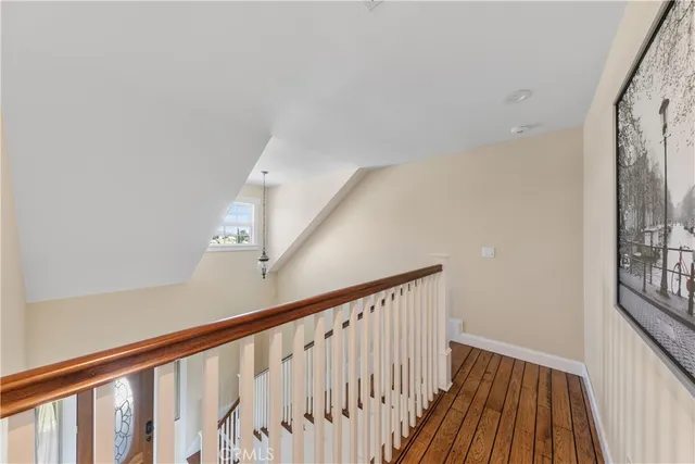 a living room with furniture a chandelier and a dining table