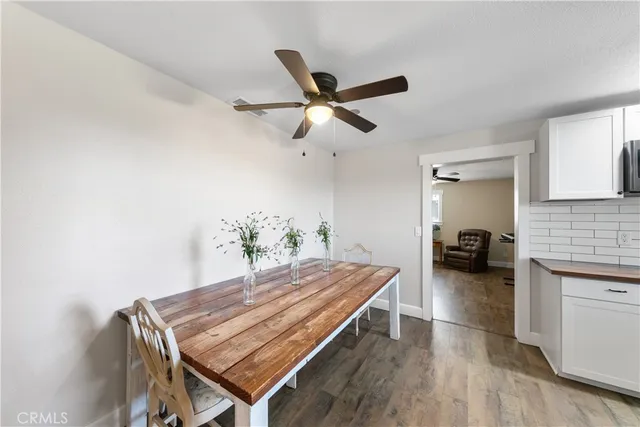 a view of a patio with a table and chairs