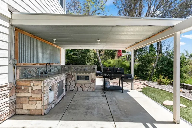 an aerial view of a house with swimming pool garden and outdoor seating