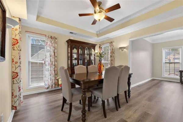 a view of a dining room with furniture and front door