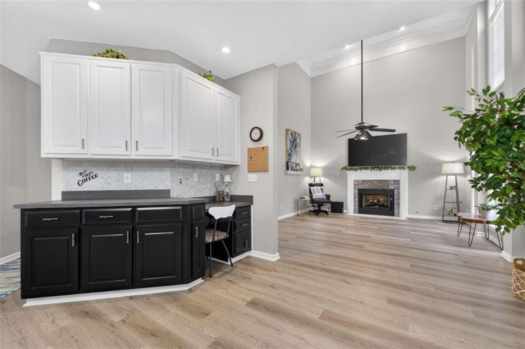230 Gaelic Way Tyrone, GA 30290 - Photo 17 of 53 a kitchen with stainless steel appliances granite countertop a stove top oven a sink a counter space and cabinets