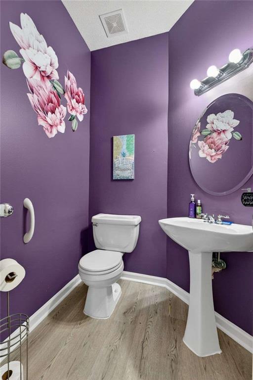 230 Gaelic Way Tyrone, GA 30290 - Photo 26 of 53 a bathroom with a toilet sink and mirror