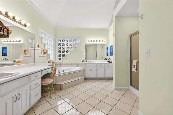 a bathroom with a bathtub sink and a mirror