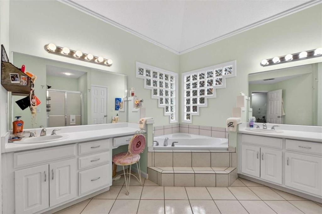 230 Gaelic Way Tyrone, GA 30290 - Photo 33 of 53 a bathroom with a double vanity sink mirror and bathtub