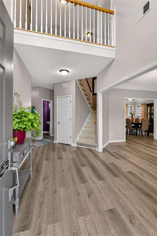 230 Gaelic Way Tyrone, GA 30290 - Photo 4 of 53 a view of an entryway with wooden floor
