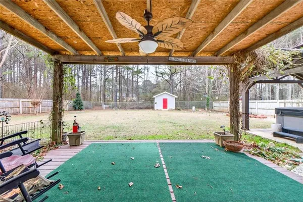 a backyard of a house with outdoor seating