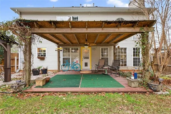 a view of a house with a yard and garage