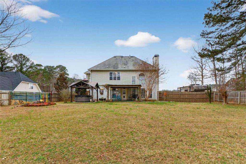 230 Gaelic Way Tyrone, GA 30290 - Photo 47 of 53 a view of a house with a yard and garage