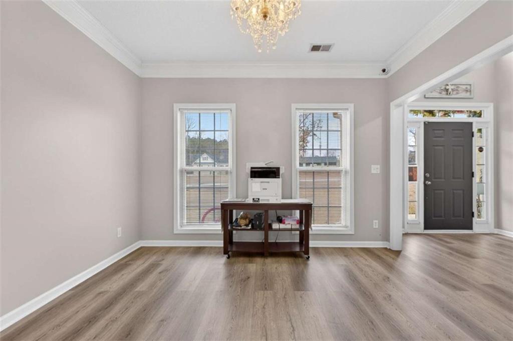 230 Gaelic Way Tyrone, GA 30290 - Photo 8 of 53 a living room with furniture and wooden floor