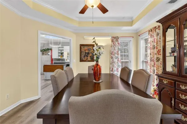 a view of a dining room with furniture window and wooden floor
