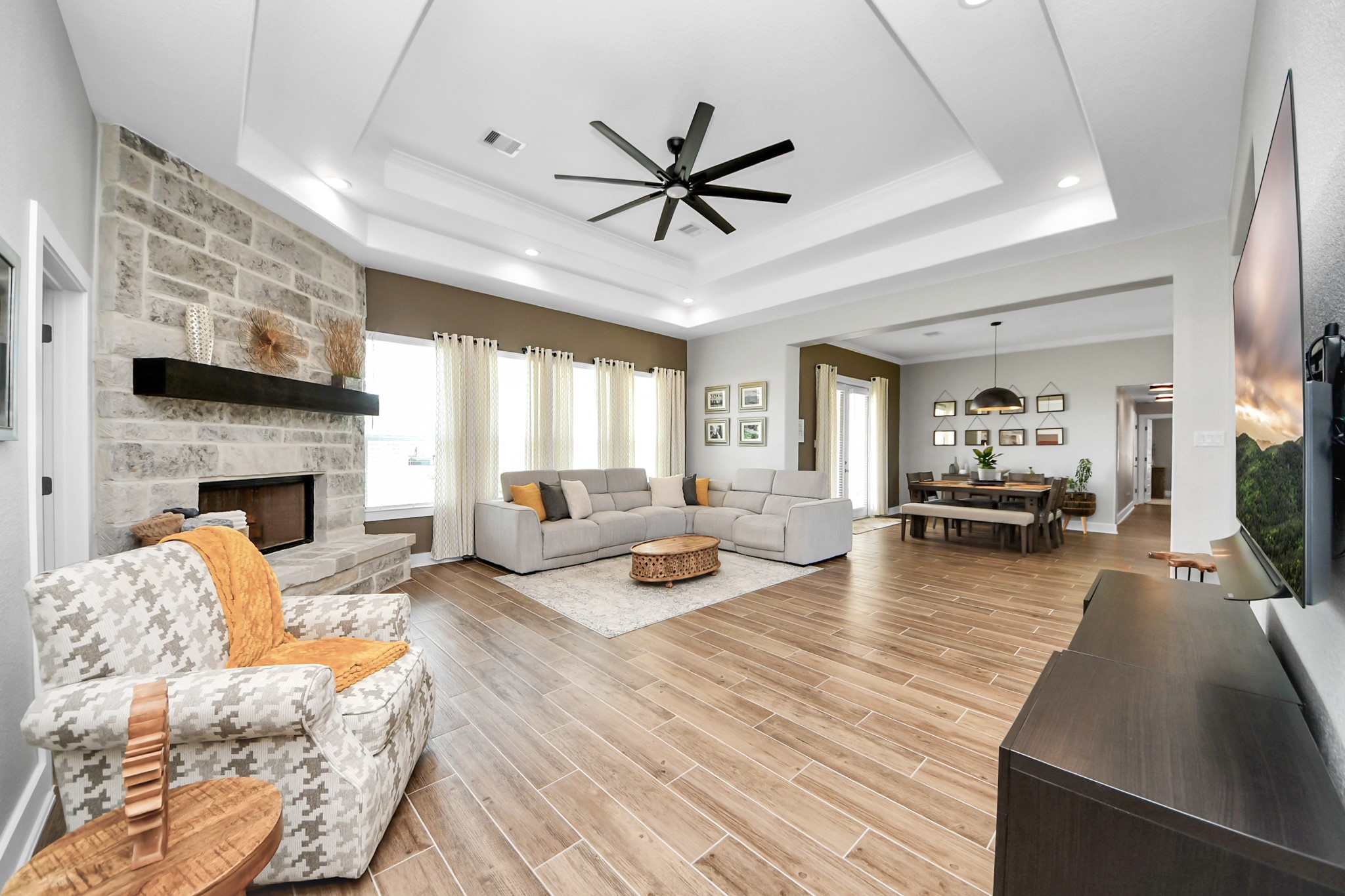 a living room with furniture fireplace and a flat screen tv